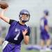 Pioneer High School's Brandon Bertora looks to throw the ball during the first day of practice on Monday, August 12, 2013. Melanie Maxwell | AnnArbor.com